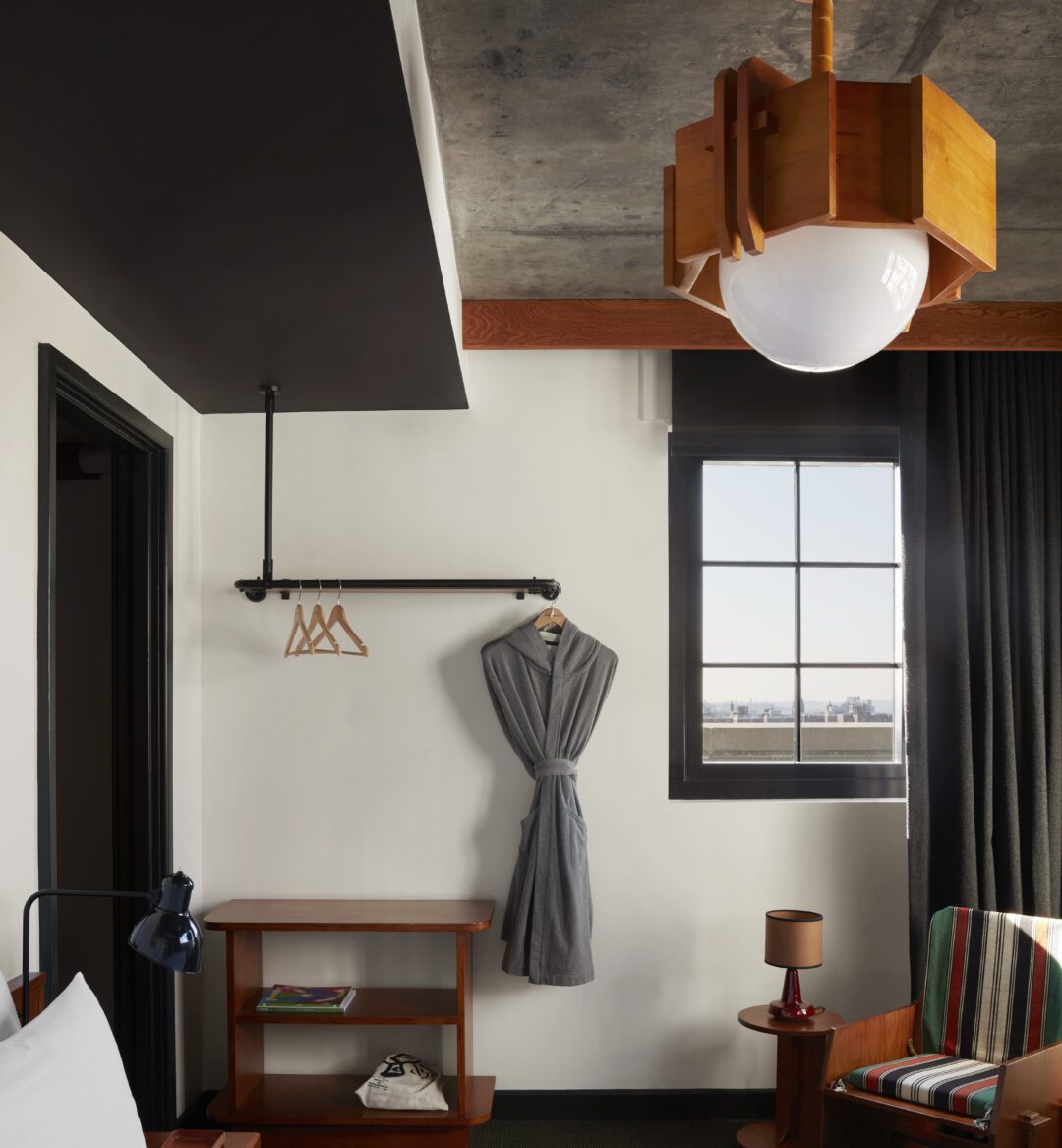 A dedicated bedroom with windows overlooking different parts of the city