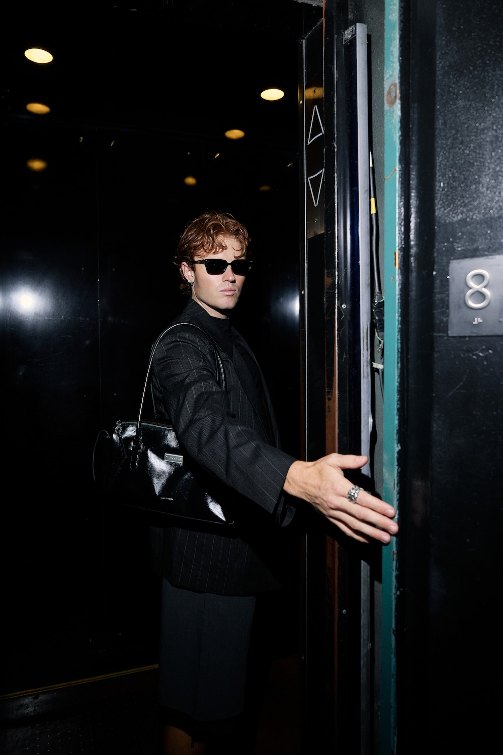 NYC Fashion Week - man holding a door open